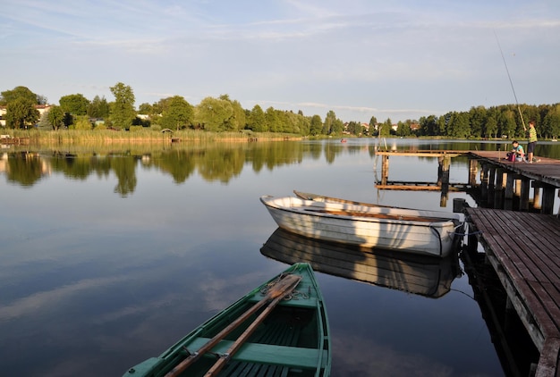 Boats moored in river