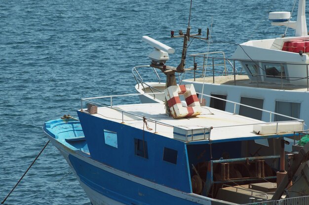 Boats moored in sea