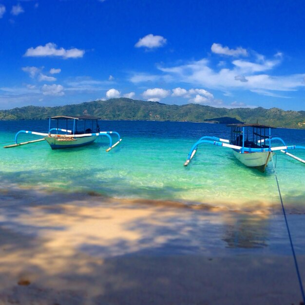 Boats moored in turquoise lagoon