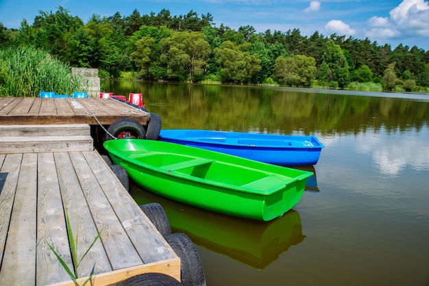 boats near wooden dock peaceful landscape nobody