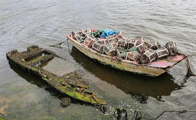 Photo boats prepared with pots for fishing combardo galicia spain