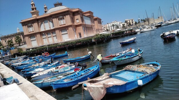 Boats in river with buildings in background