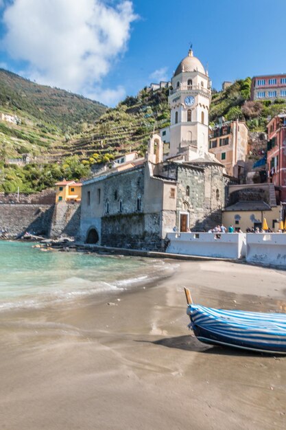 Boats in sea against buildings