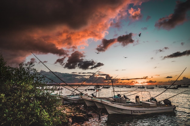 Boats on a sunset view at Rio Lagartos, Yucatan, Mexico