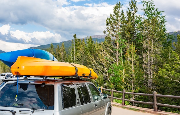 Photo boats on top of a car.