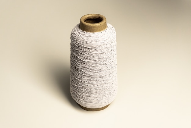 Premium Photo  A bobbin of thick thread yarn