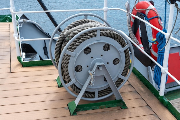 Bobbins with a rope on the deck of the ship closeup