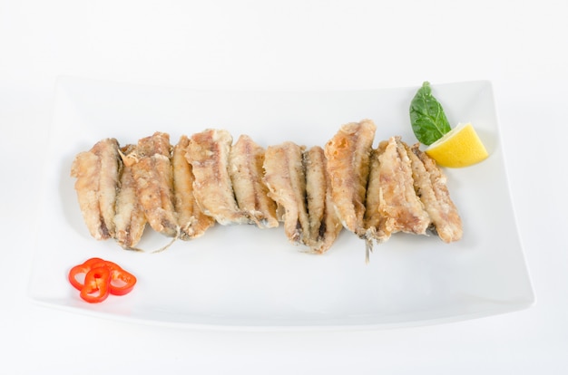 Bocartes or fried anchovies.