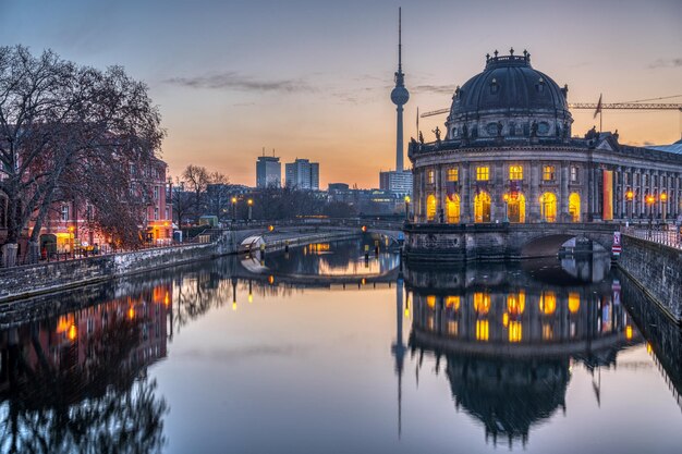 The bode museum the television tower and the river spree in berlin before sunrise