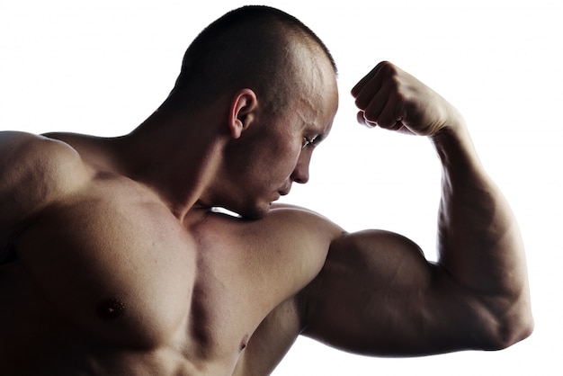 Body builder champion posing in studio