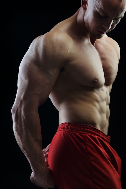 Body builder champion posing in studio