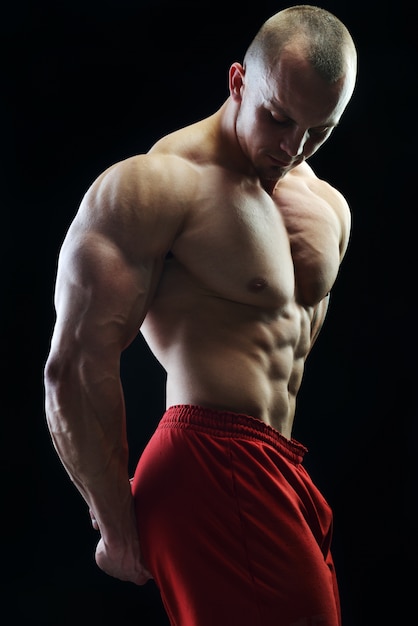 Body builder champion posing in studio