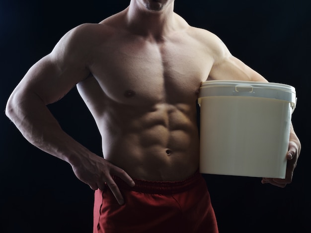 Body builder champion posing in studio