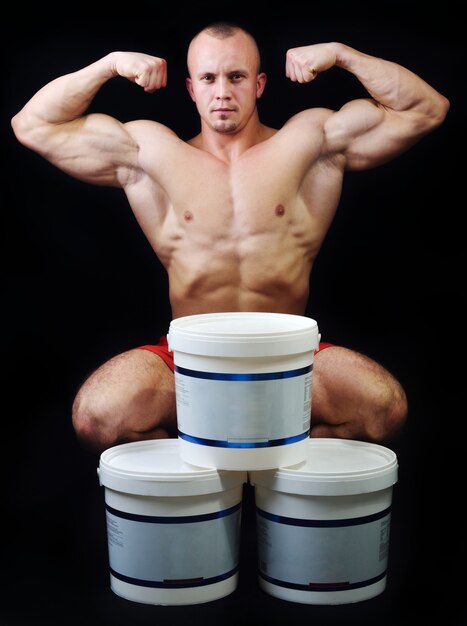 Body builder champion posing in studio