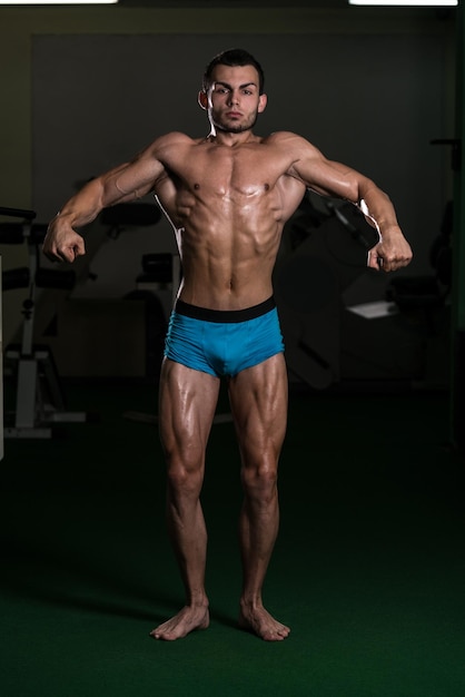 Body builder Performing Front Relaxed Poses