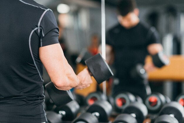 Body building champion exercising in the gym