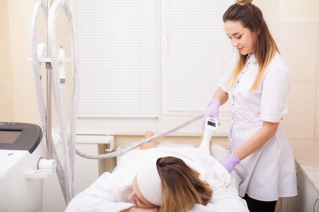 Body Care. Woman is in the process at the clinic lipomassage