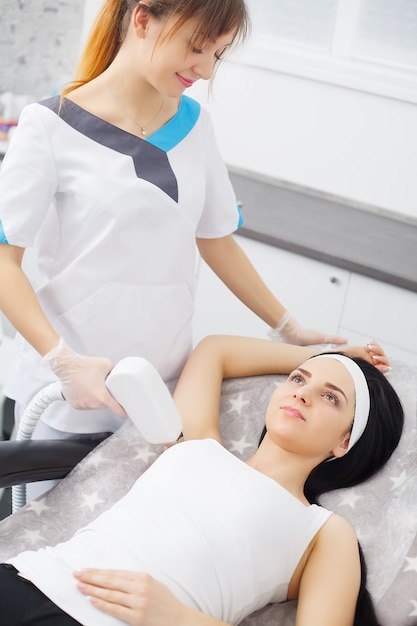 Body Care. Woman Receiving Face Skin Analysis. Cosmetology