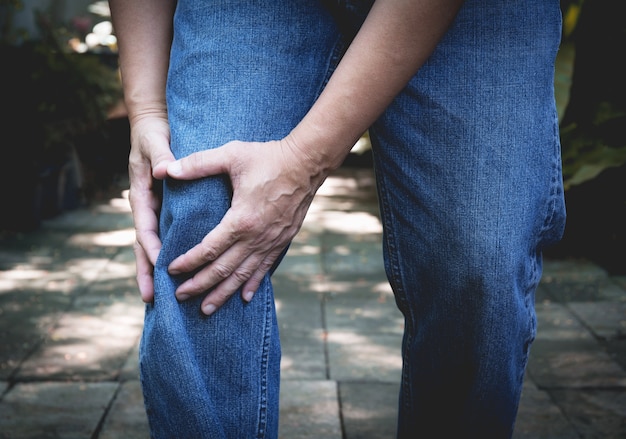 Body pain. close-up male body with pain in knees. 