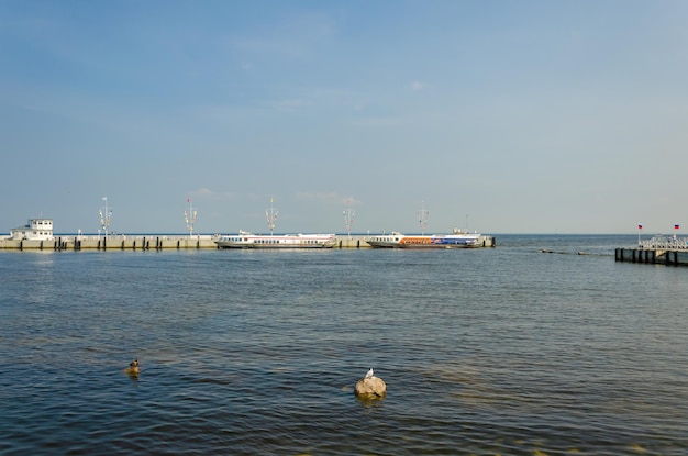 A body of water with a boat in the background