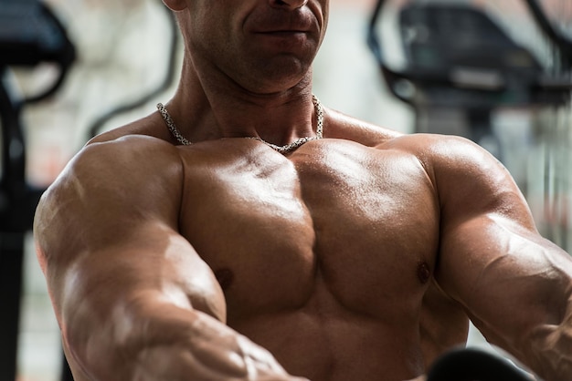 Bodybuilder Doing Heavy Weight Exercise For Back