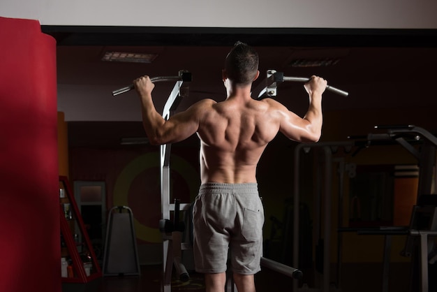 Bodybuilder Doing Pull Ups Best Back Exercises