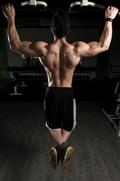 Bodybuilder Doing Pull Ups Best Back Exercises