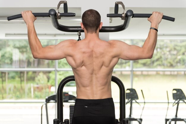 Bodybuilder Doing Pull Ups Best Back Exercises