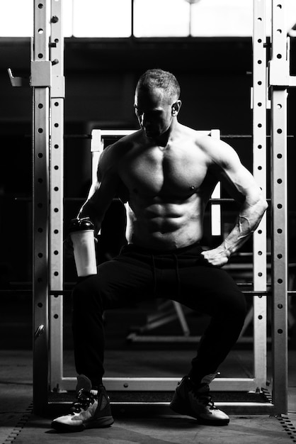 Bodybuilder Drinking Water From Shaker