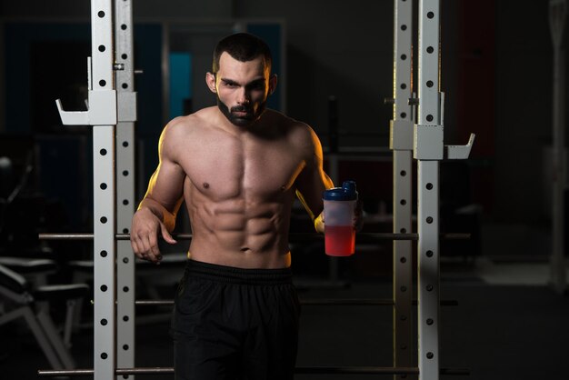 Bodybuilder Drinking Water From Shaker