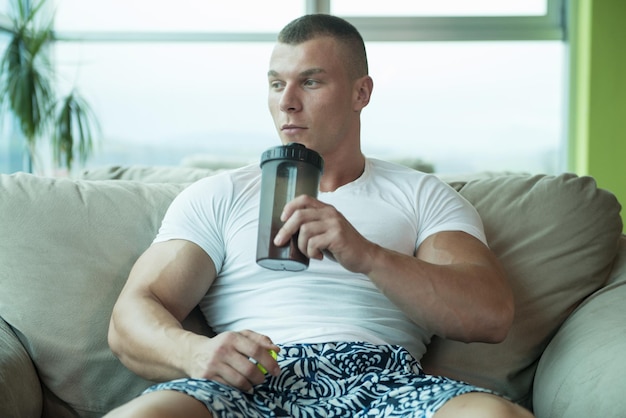 Bodybuilder Drinking Water From Shaker