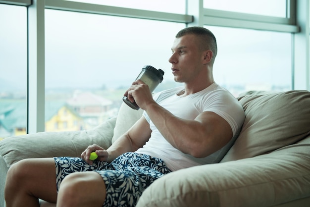 Bodybuilder Drinking Water From Shaker