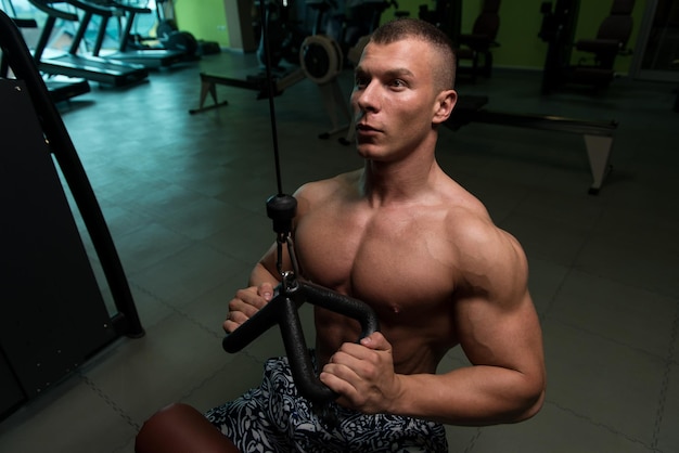 Bodybuilder Exercise Back On Machine