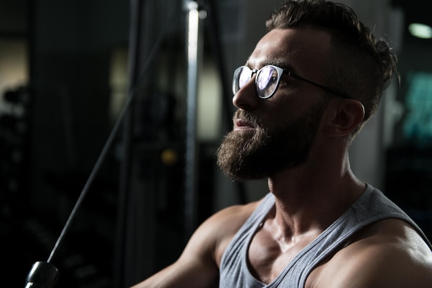 Bodybuilder Exercising Chest On Machine