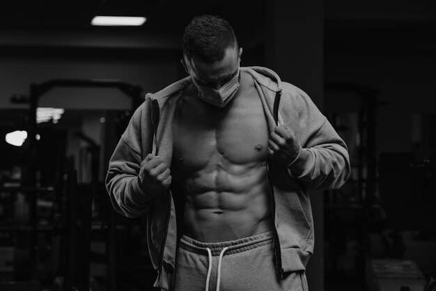 Bodybuilder in a Hood in the Gym