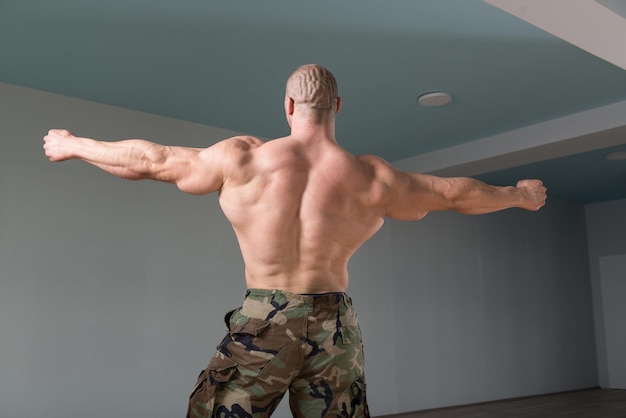 Bodybuilder Flexing Muscles