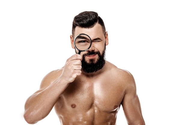 Bodybuilder holding magnifier