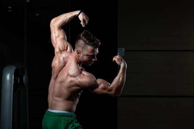 Bodybuilder Performing Rear Double Biceps Pose