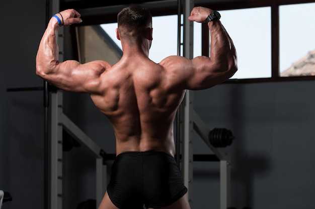 Bodybuilder Performing Rear Double Biceps Pose