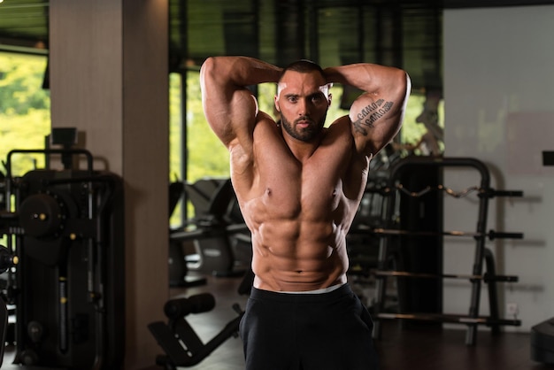 Bodybuilder Posing In The Gym