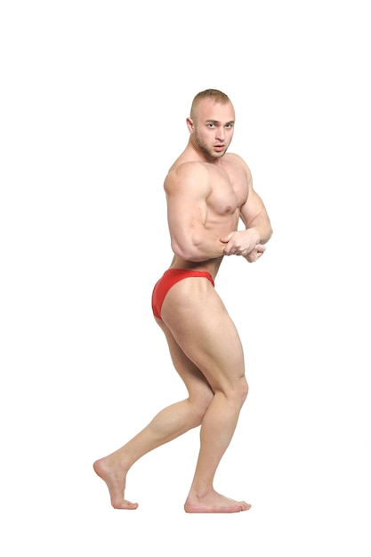 Bodybuilder posing his muscles on white background