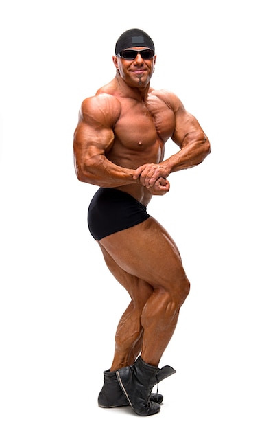 Bodybuilder posing isolated on white