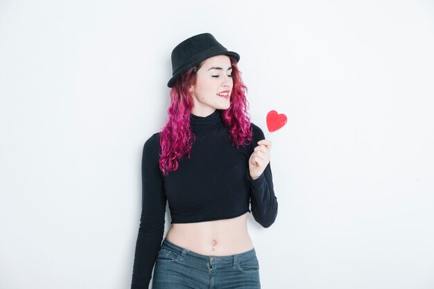 Bohemian woman holding a piece of candy with no diet