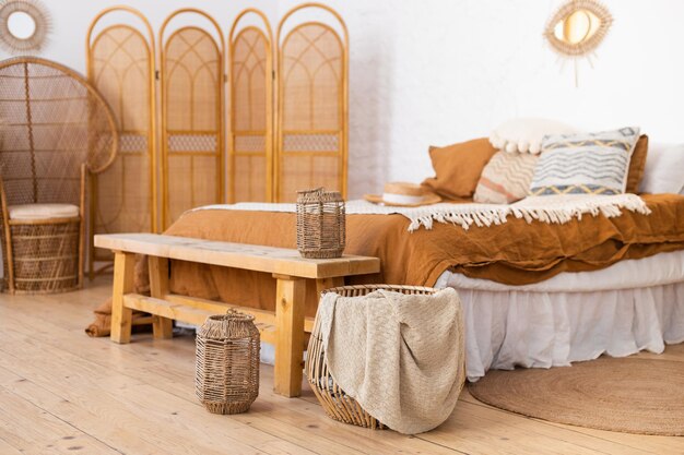 boho style bedroom with wicker screen baskets and wooden bench