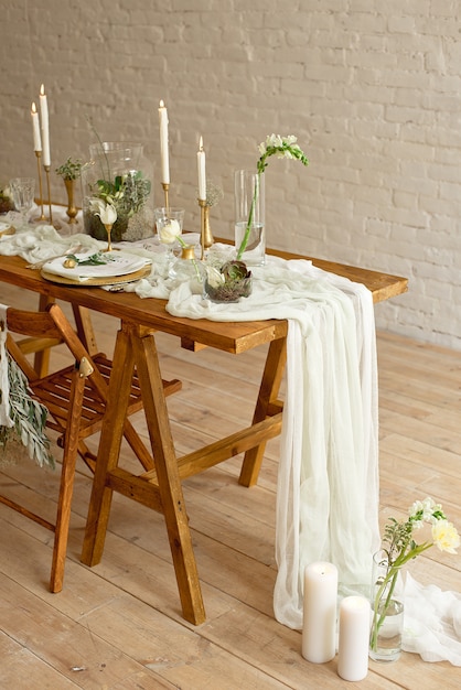 Boho wedding table setting, rustic decorations, gold and blue details, wooden table.Luxury wedding decor.