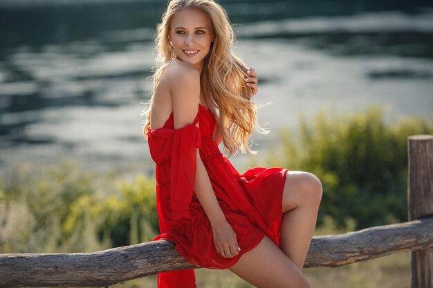 Boho woman relaxing in summer countryside Atmospheric rural moment simple slow life style Sexy girl relaxing in park