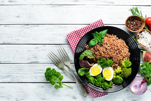 Boiled buckwheat with egg and broccoli Dishes menu Free copy space Top view