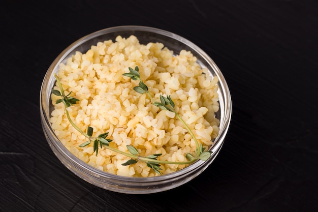 Boiled bulgur porridge with herbs