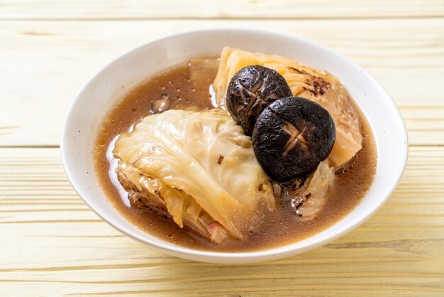 boiled cabbage in red soup with mushroom