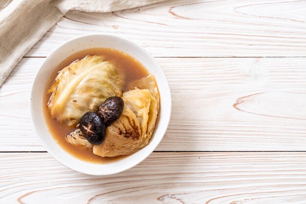 boiled cabbage in red soup with mushroom